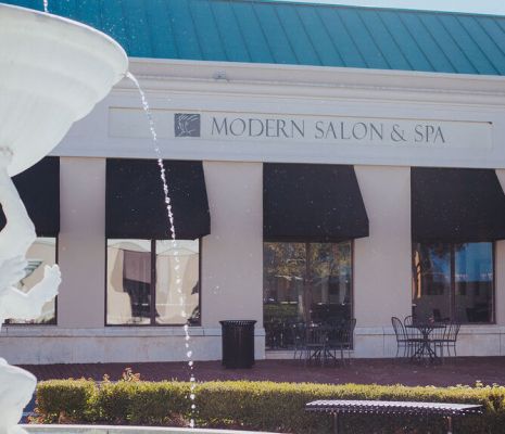 Exterior of Modern Salon & Spa in Charlotte, NC with fountain