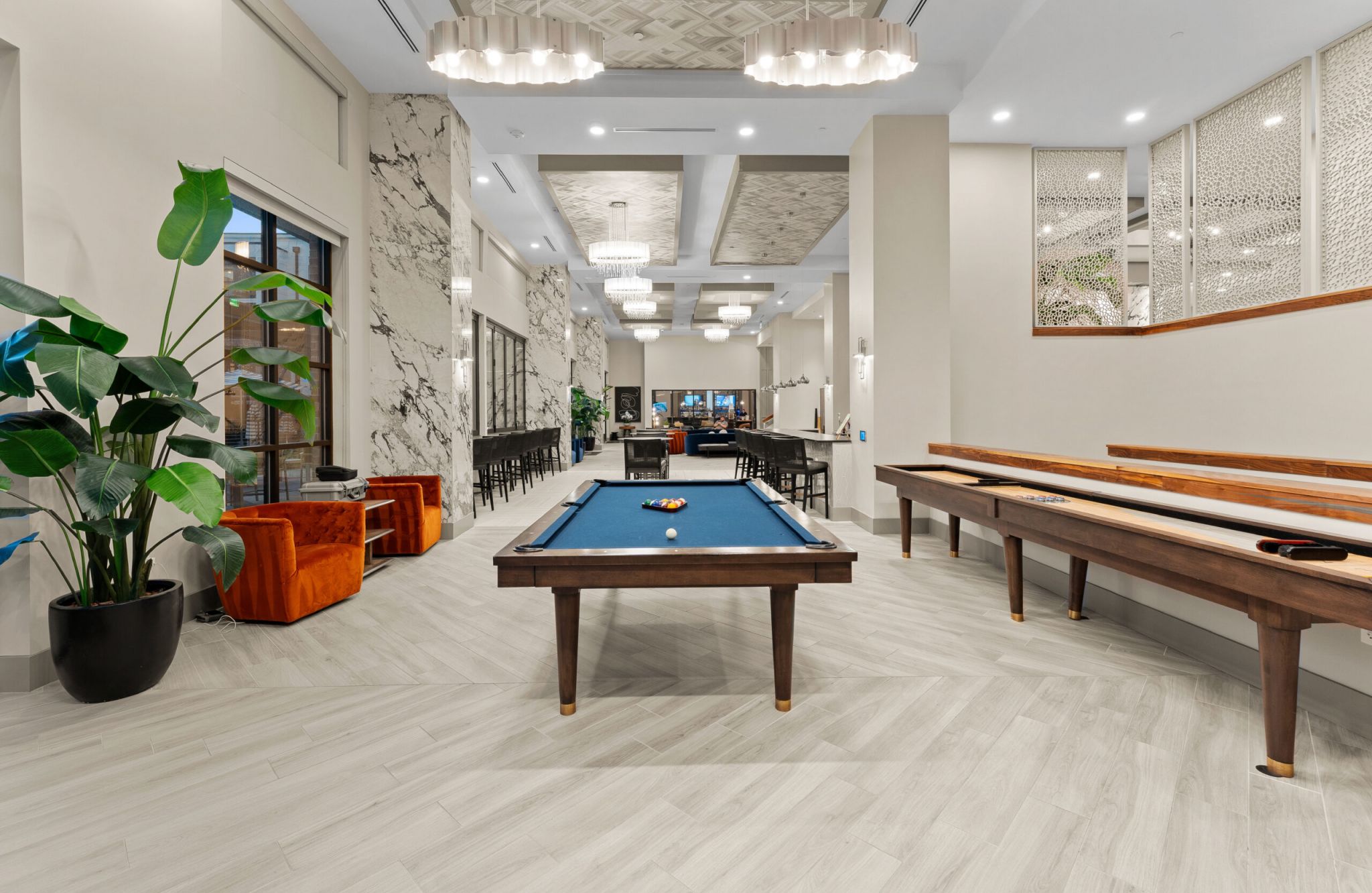 Luxury pool with blue water outside of Providence Row Apartments