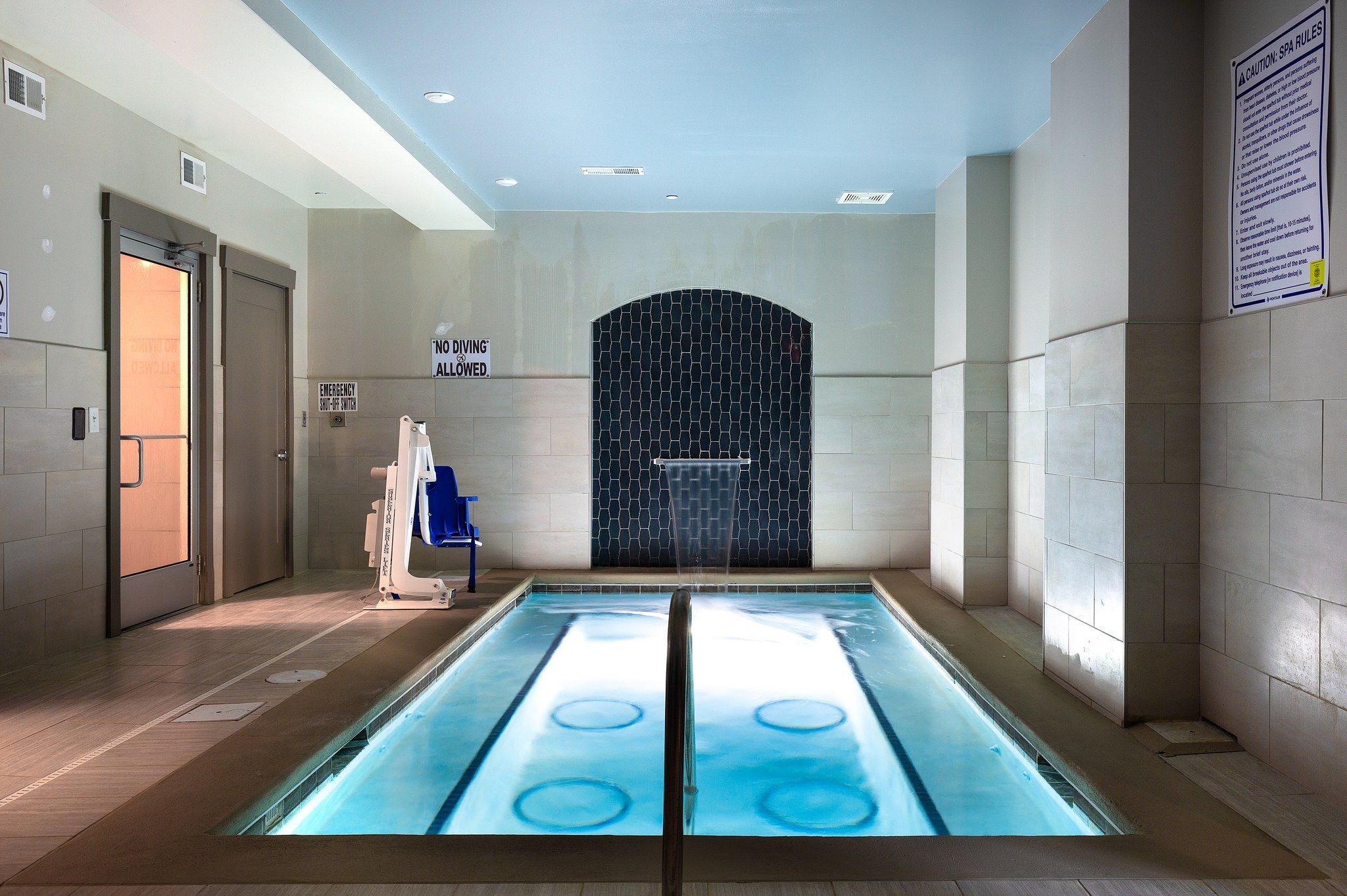 Indoor spa with integrated fountain at Providence Row Apartments