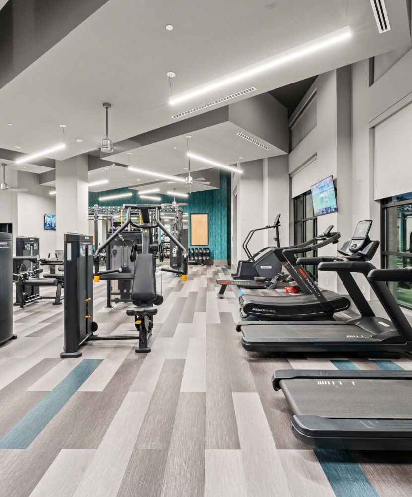 Concept2 rower inside large luxury apartment fitness space