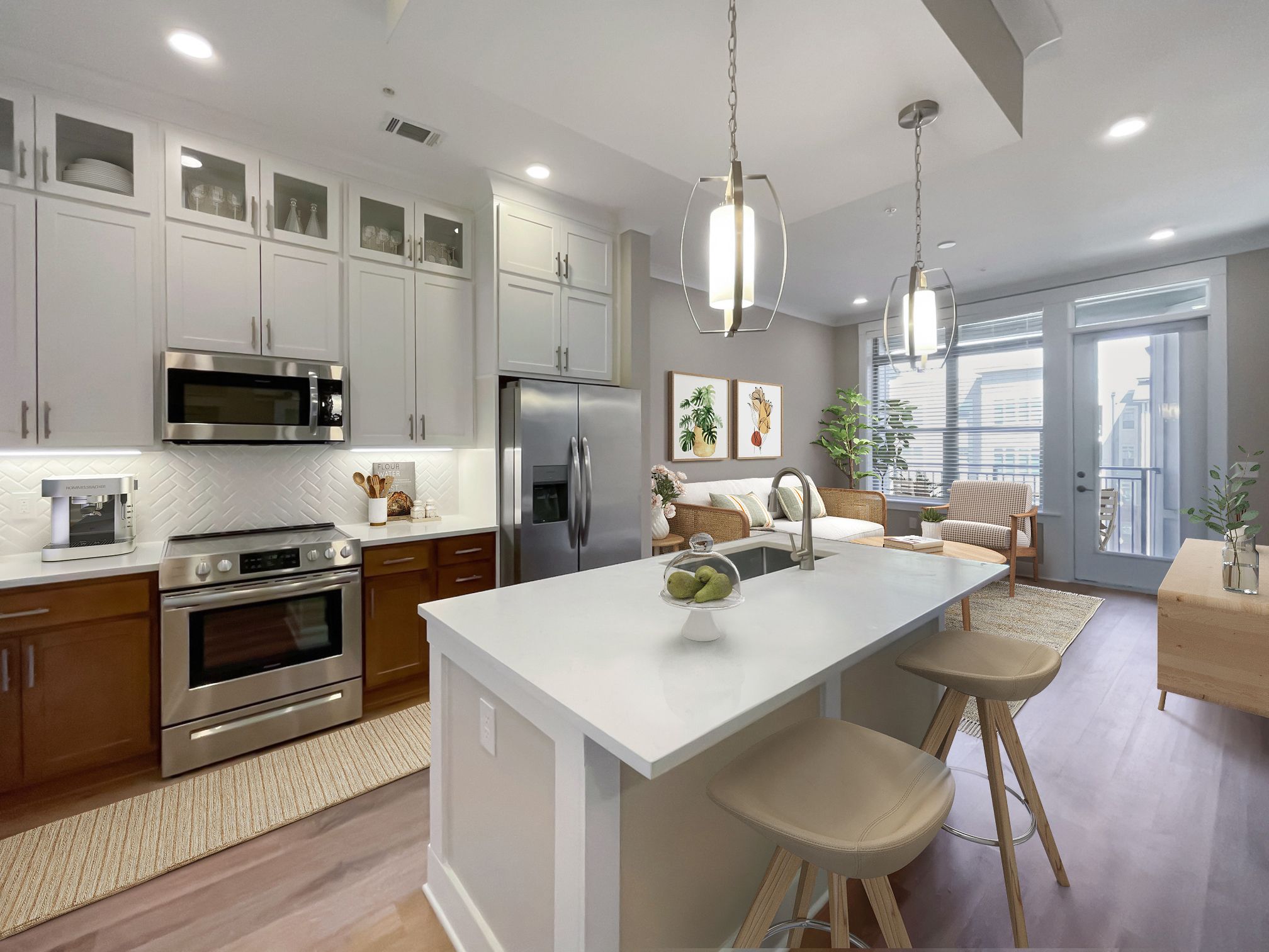 One bedroom apartment kitchen with floating island, stainless steel appliances, and floor-to-ceiling cabinets at Providence Row