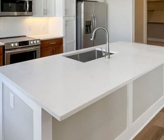 Kitchen island with quartz countertop, deep sink, and gooseneck faucet