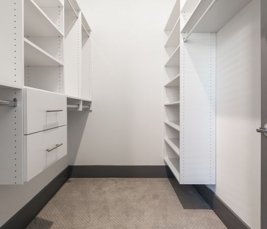 Custom closet shelving with extra shelves and drawers at luxury Charlotte apartments