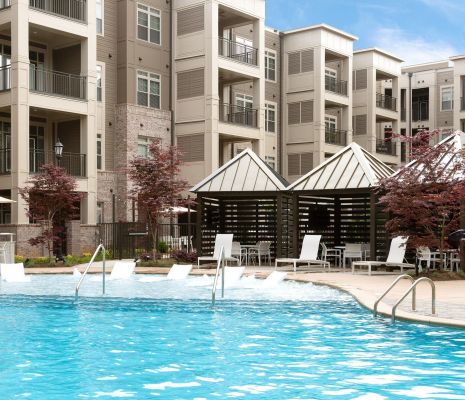 Luxury pool with lounge chairs and private cabanas at Charlotte, NC apartments