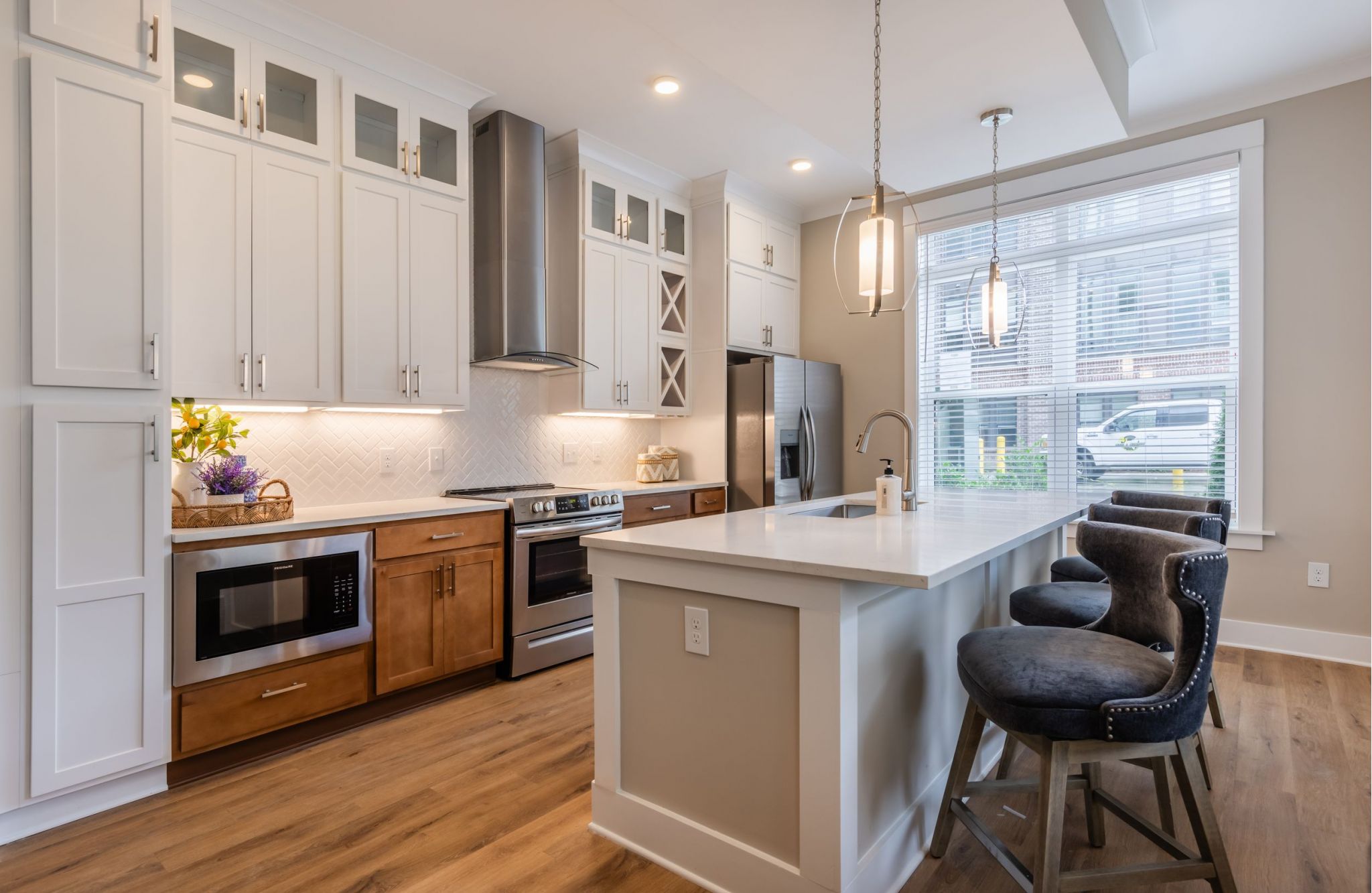 Beautiful Phase II kitchen with two tone cabinets at Providence Row apartments