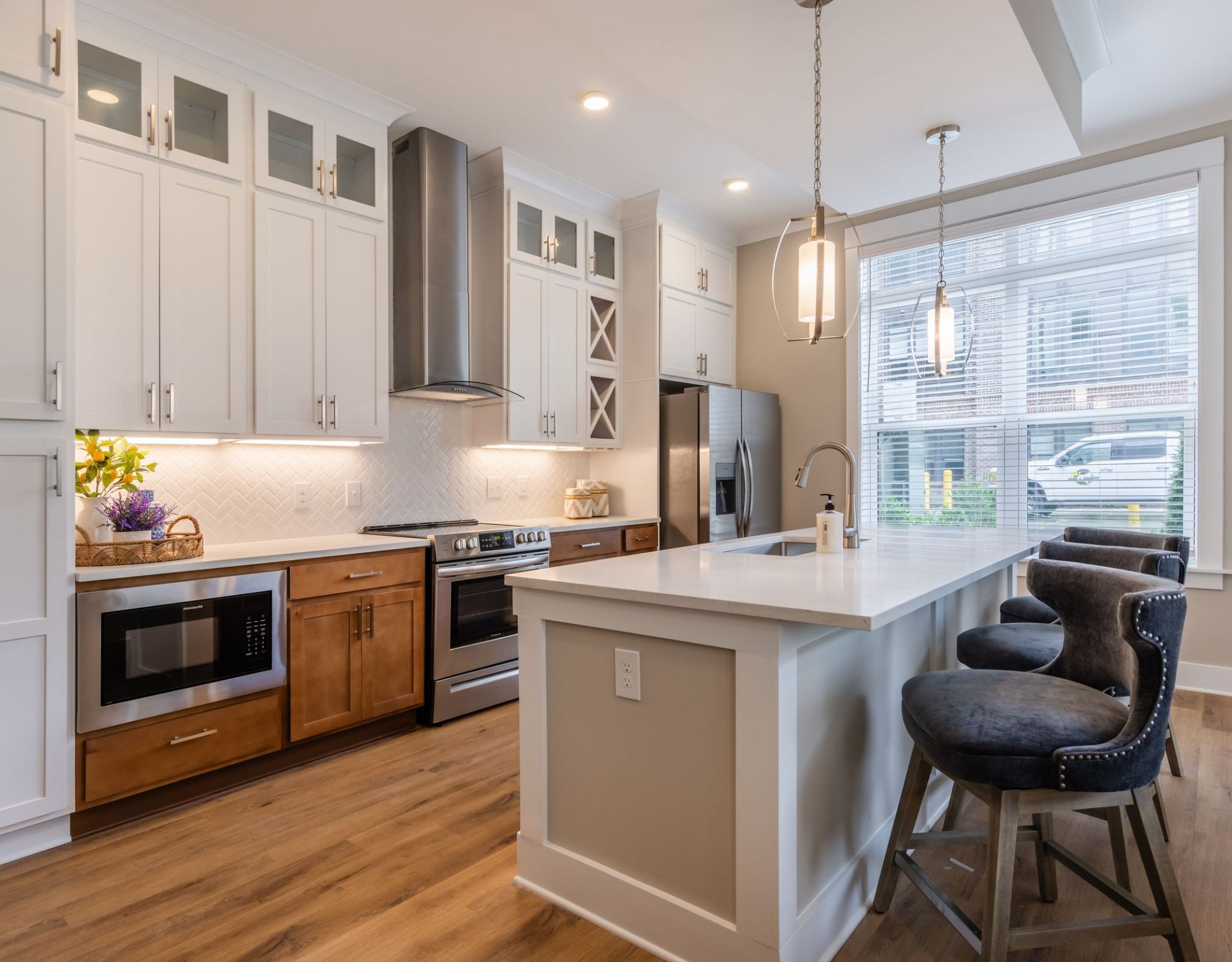 Beautiful Phase II kitchen with two tone cabinets at Providence Row apartments