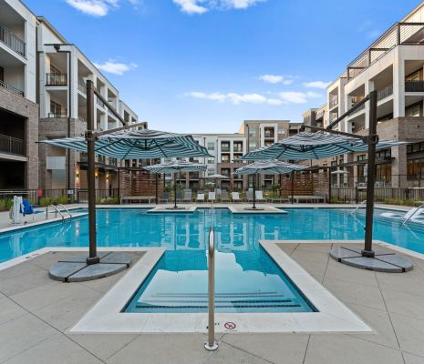 Luxury pool with lounge chairs and private cabanas at Charlotte, NC apartments