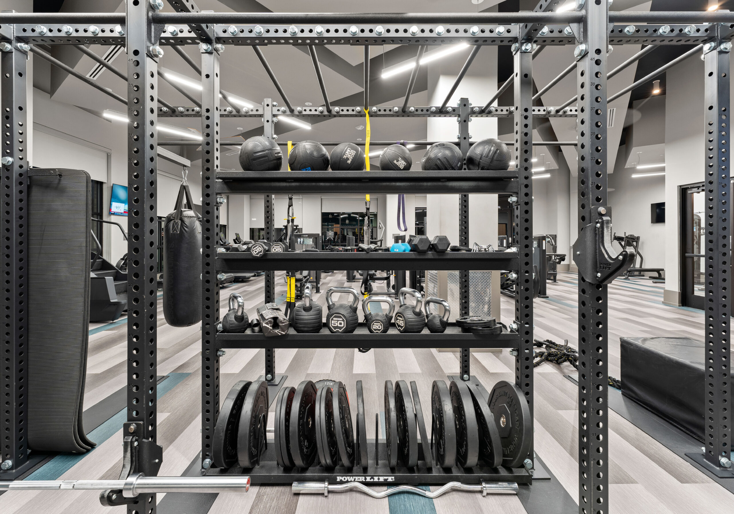 Fitness equipment inside Providence Row Apartments' large gym and fitness space for residents